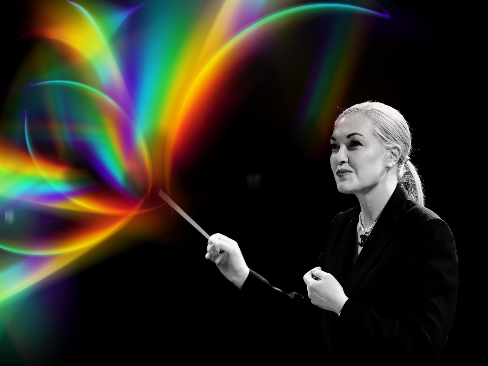 Sarah Grace Williams conductor TMO with rainbow flare from baton